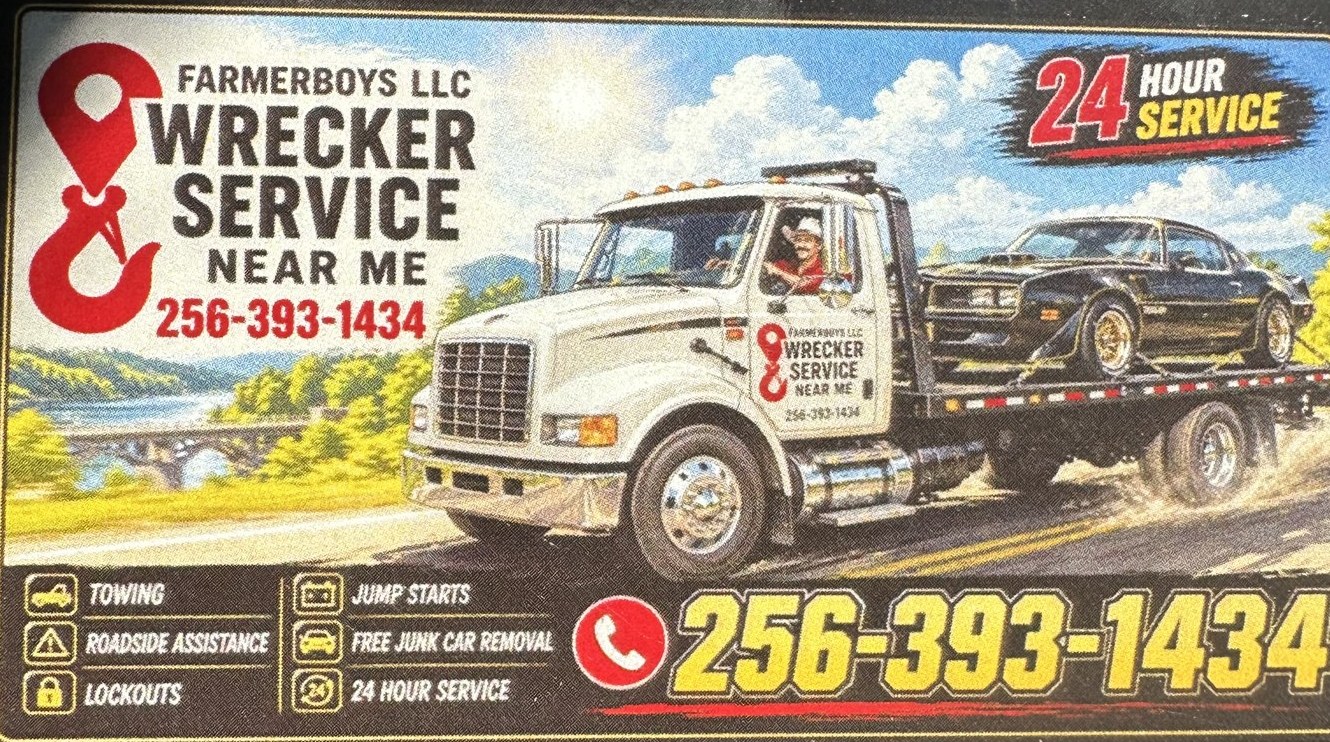 The Farmerboys Wrecker Service business card: a white rollback wrecker hauling a black car, 24 hour service